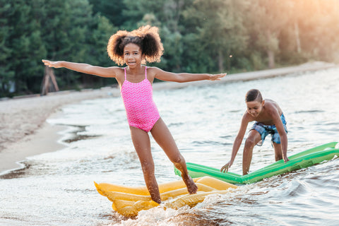 two kids playing at the beach