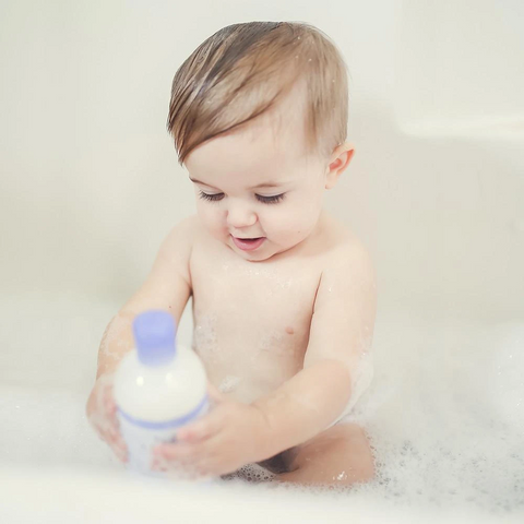 Toddler taking bath during bedtime routine