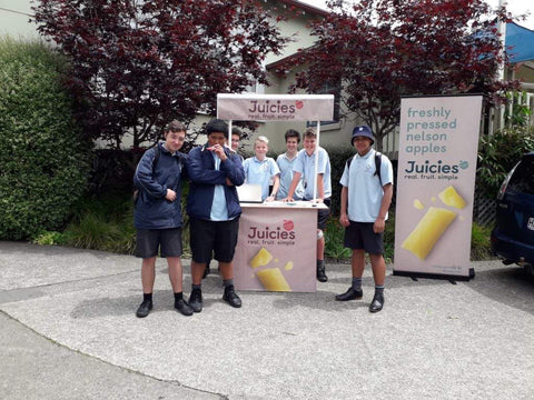 School food sales, pupils selling Juicies to students outside in New Zealand