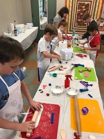 Making fondant flowers for cupcakes at Chantilly Tea's Kids Camp at Botanical Gardens