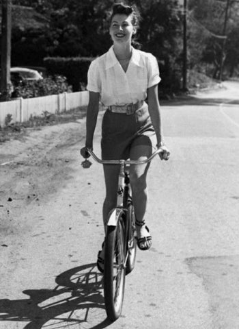 Ava Gardener riding a bike 