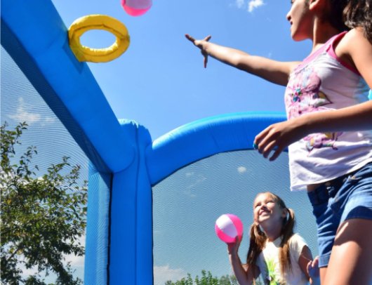 residential bounce house with basketball hoop