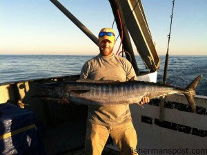 David Supa, of the Cape Fear Community College Marine Tech Program, with a 42 lb. wahoo that he hooked 34 miles off Oregon Inlet, NC on a Black & Purple Monkalur while trolling from the R/V Dan Moore. 