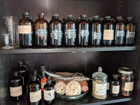 apothecary bottles filled with herbs