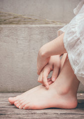close up of womans hands and feet