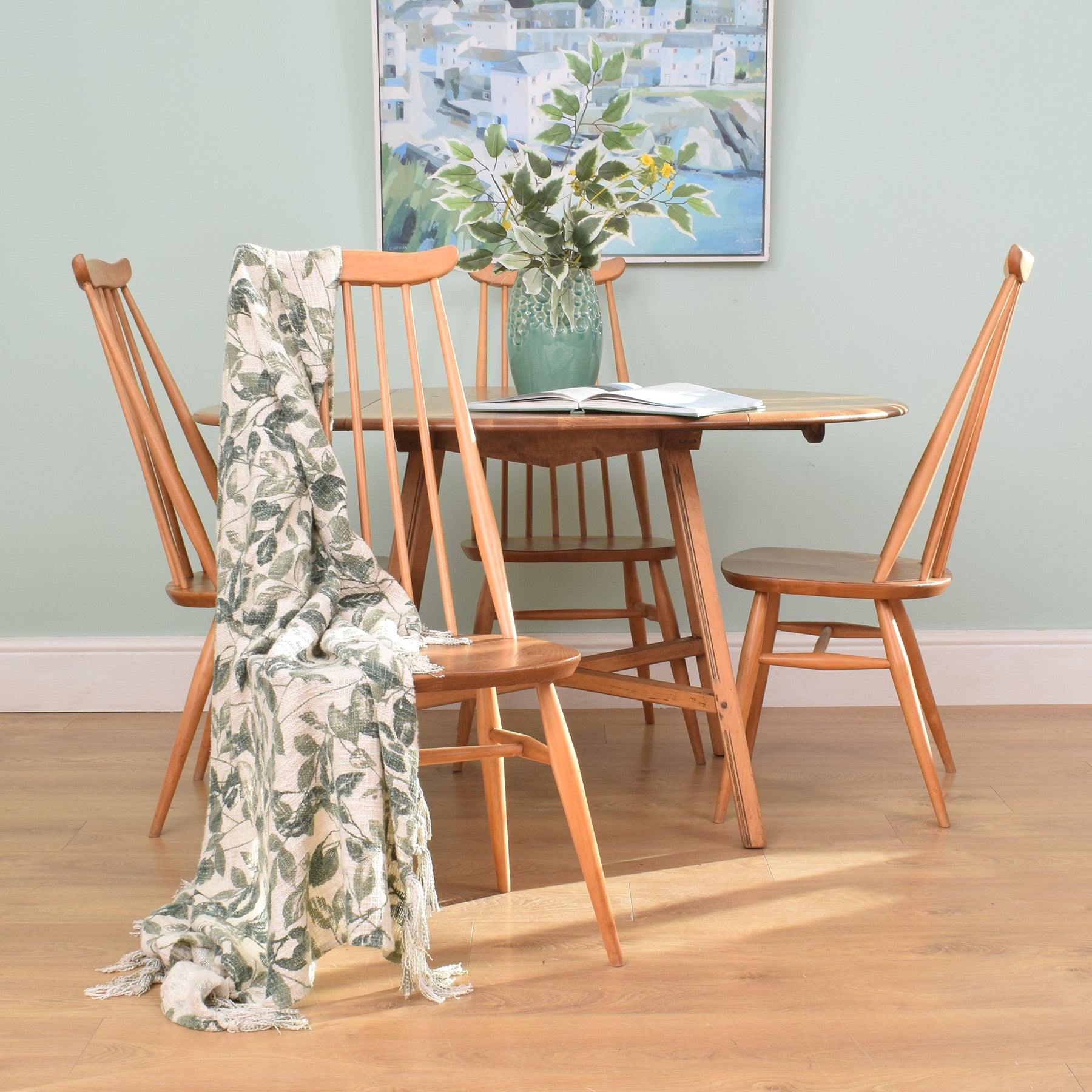 drop leaf table with four chairs