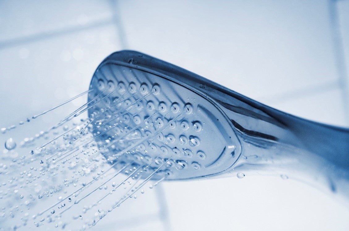 Shower head providing de-congesting steam