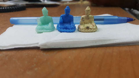 Buddha design in Resin, Wax, and Gold (left to right)