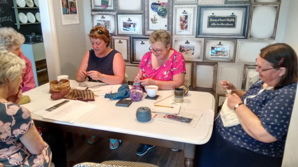 knitters at table