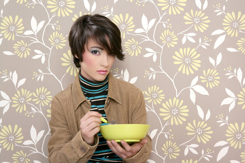 Gender non-defined person eating granola