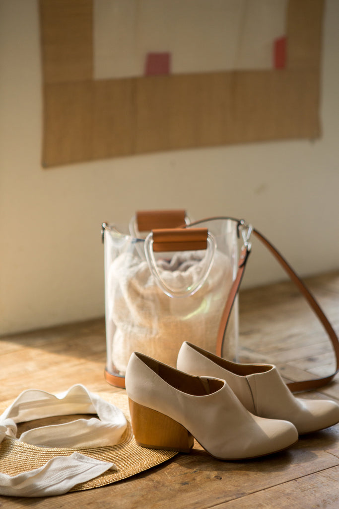 Image of the Coclico Bonita Heel in Powder leather amongst decor.