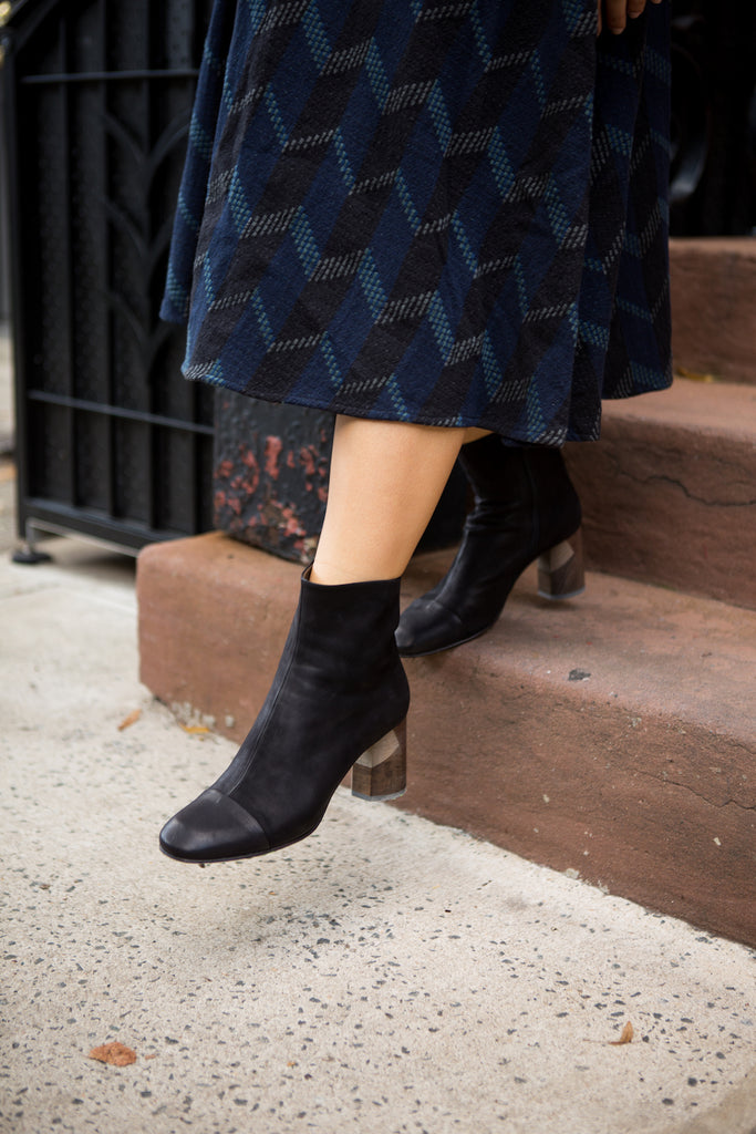 Close up of a woman walking in the Laeve Bootie.  