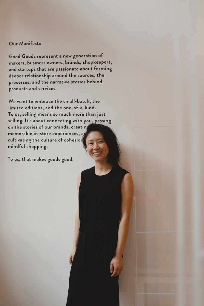 Image of Rosa Ng, founder of Good Goods leaning against a wall smiling into the camera.
