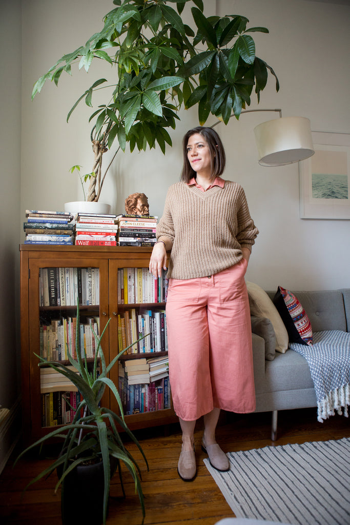  Uli Beutter Cohen, the founder of Subway Book Review leaning against her bookshelf.