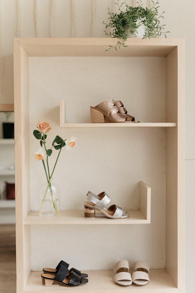 Shelf at Umeboshi displaying Coclico heels along with decor. 