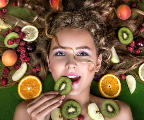 girl face with fruit slices around her