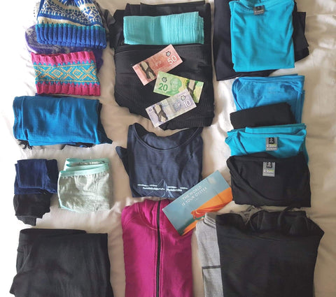 Merino wardrobe packing for trip to variable climes Turq and black merino clothing