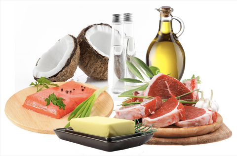 Olive oil, butter, red meat, green leaks , coconut fruit and garlic with white background