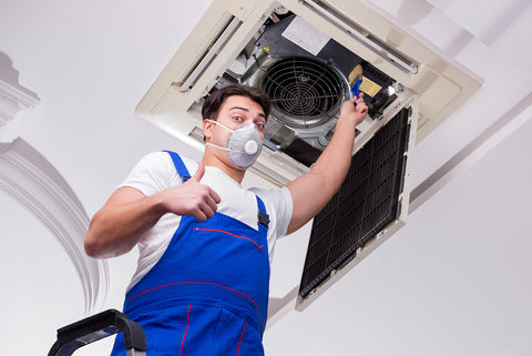 Technician Installing Air Conditioning