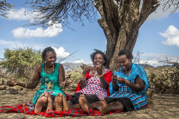 maasai women in kenya making love is project bracelets sharing laughter and love