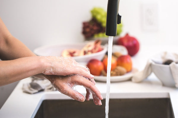 cleaning-hands-water-soap-faucet-kitchen-sink