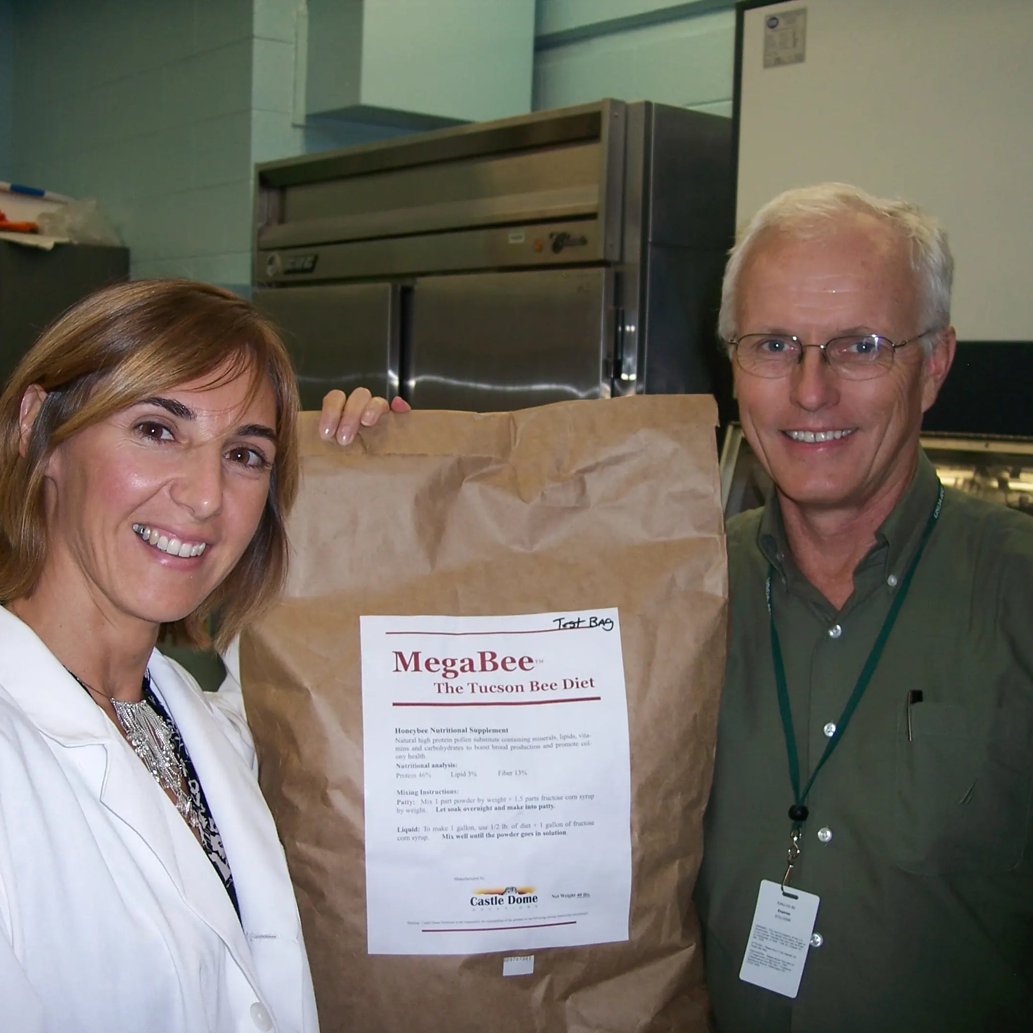 Gordon and Fabiana holding up the first official bag of MegaBee ever made