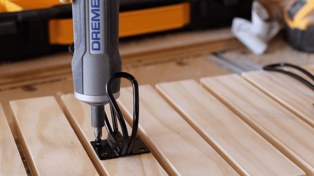 Dremel Go Screwdriver driving in coat hook screws