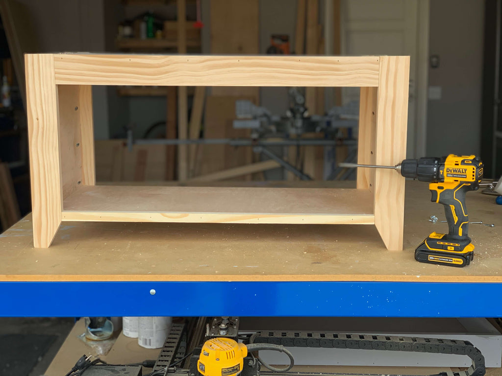 DIY Hall Tree Bench sitting on a Kreg Workbench with a DEWALT ATOMIC 20-Volt MAX Lithium-Ion Cordless Brushless 1/2 in. Compact Hammer Drill