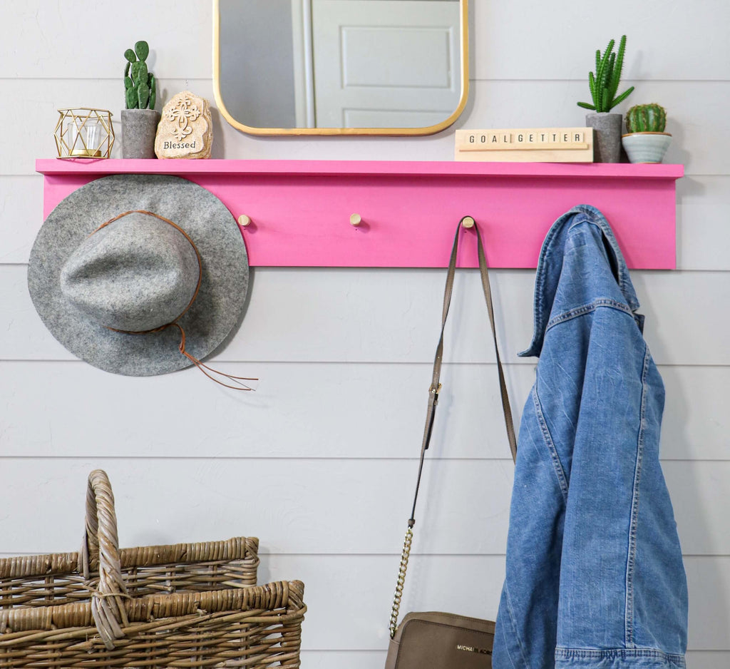 DIY Wall Coat rack behind a shiplap wall with a hat, purse and jean jacket hanging
