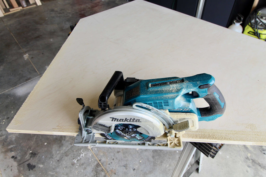 Cutting out a house shape on plywood with Makita Rear Handle Circular Saw