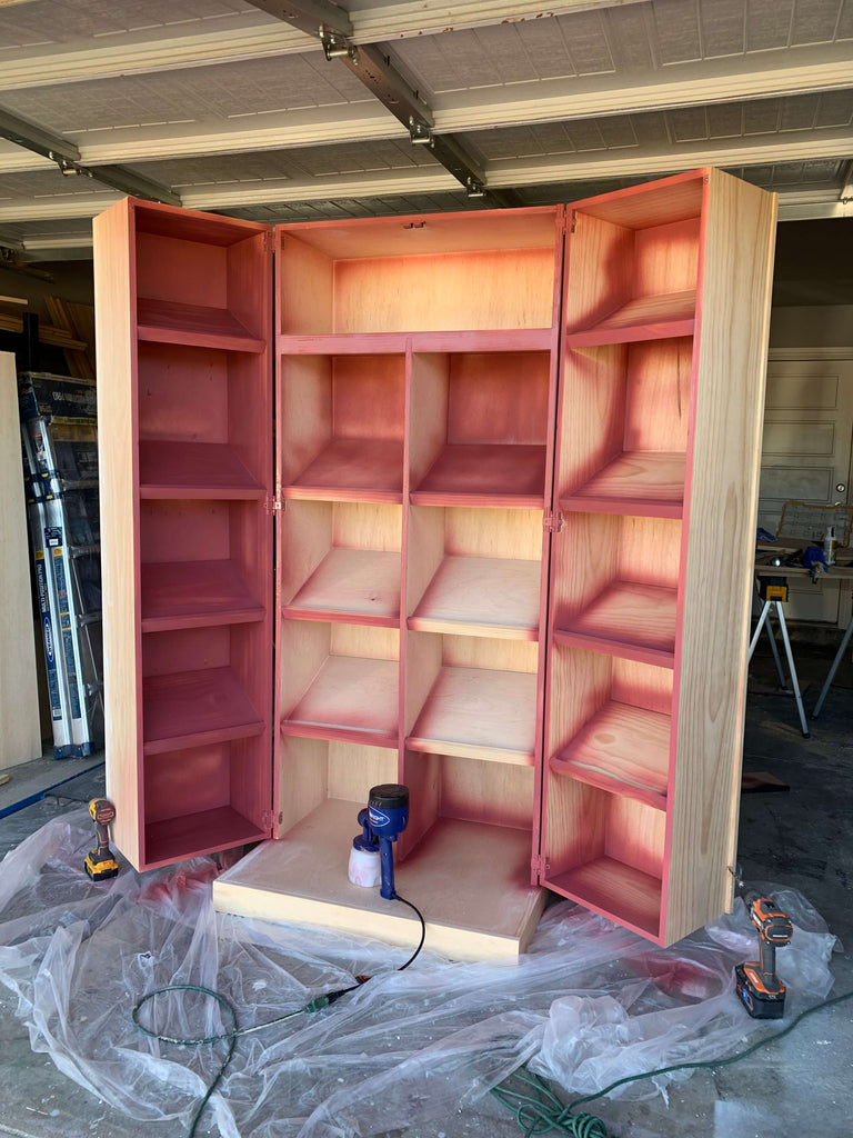 Shoe Cabinet being spray painted with a Home Right Sprayer