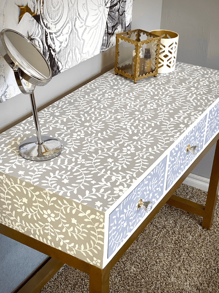 Makeup Vanity desk featuring a stenciled design and gold desk legs