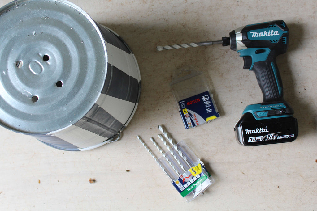 Drilling holes in a Zinc Flower Pot with a Makita Impact Drill and Bosch Carbide Bit