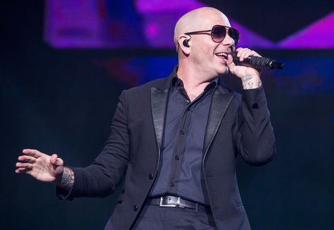 Rapper Pitbull performing at song, photo taken by Scott Legato through Getty Images 