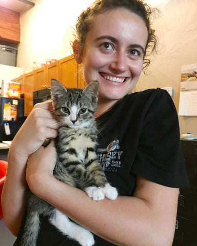 Customer Service Agent Danielle at home with striped cat Alex