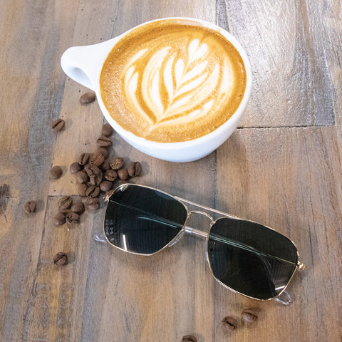 Wired framed sunglasses with a coffee shop latte