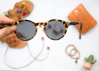 Leopard print sunglasses with scratched lenses