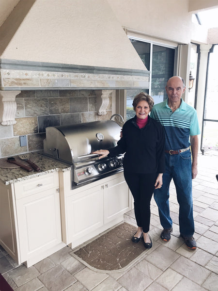 Mary and David in their outdoor kitchen area