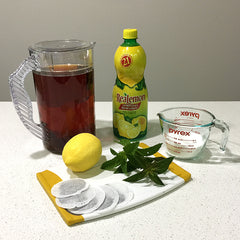 Iced tea in jug, sugar, lemon, mint and tea bags recipe by Janet Rice-Bredin of Pretty Warm Designs