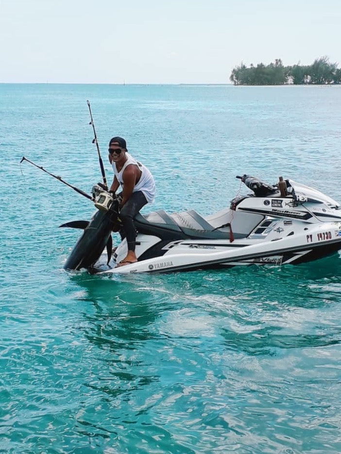 Teariiroa fishing for Ahi of his jet ski french polynesia