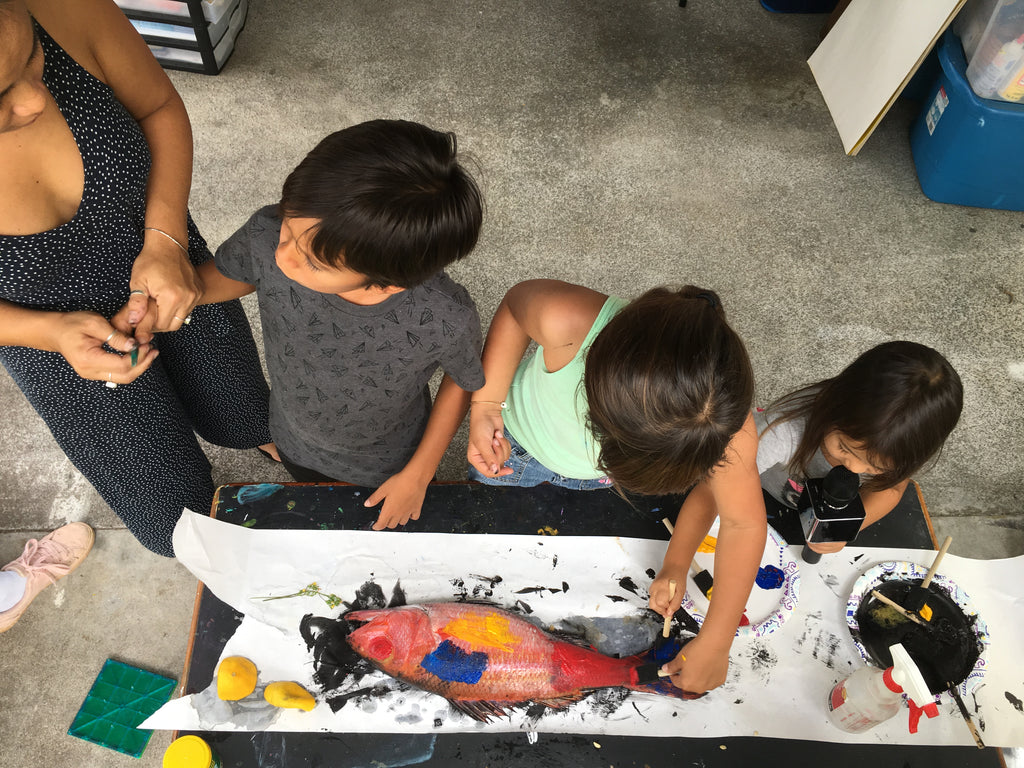 practice Gyotaku printing with our Keiki using snapper from Suisan hilo