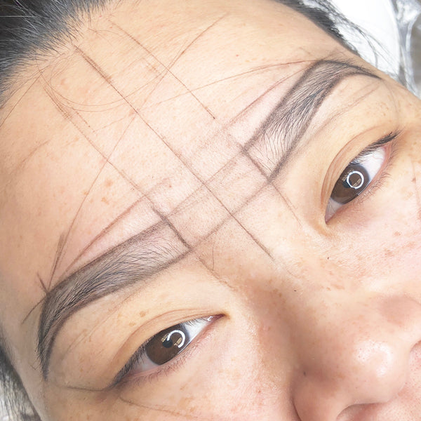 Eyebrow mapping for microblading.