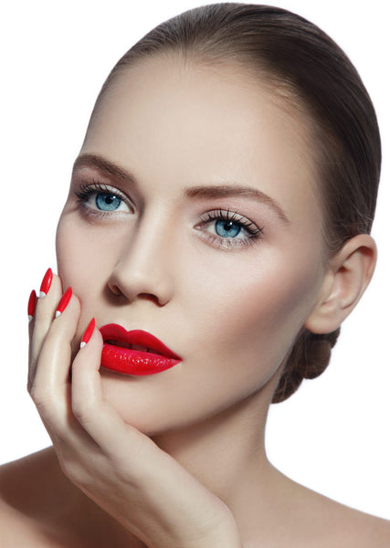 Close-up portrait of young beautiful woman with red lips.