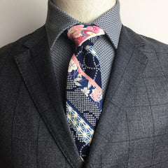 The Cherry Shibori necktie tied in a perfect Pratt knot, AKA the Shelby knot.