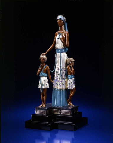 A sculpture of a Mother with two children 