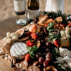 grazing platter with feta cheese and wine