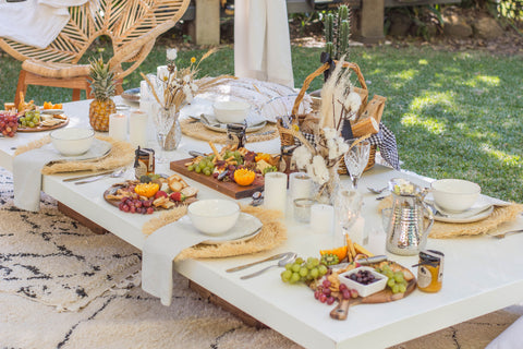 grazing table and dinnerware under a luxury arabian tent from exotic soirees hire