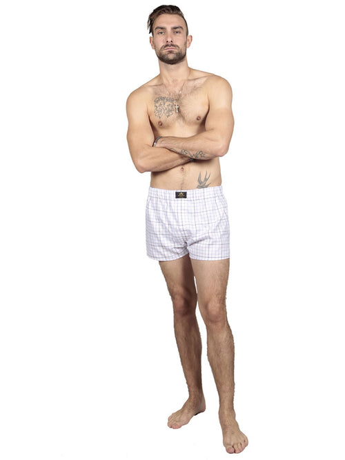 Model wearing chequered cotton boxers in multi-colours