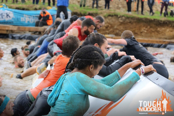 Cailin & Georgia Hanging Onto One Of The Blocks On Blockness Monster At Tough Mudder South  London