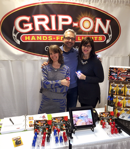 Tricia and Steve Labuzetta, Grip-On Attachable Flashlights owners, at The Atlanta International Gift & Home Furnishings Market, with Deb Fowler, owner of Milwaukee florist and gift shop, The Flower Lady.